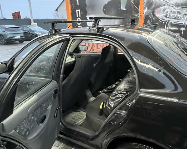Черный Дэу Ланос, объемом двигателя 1.5 л и пробегом 145 тыс. км за 1799 $, фото 15 на Automoto.ua