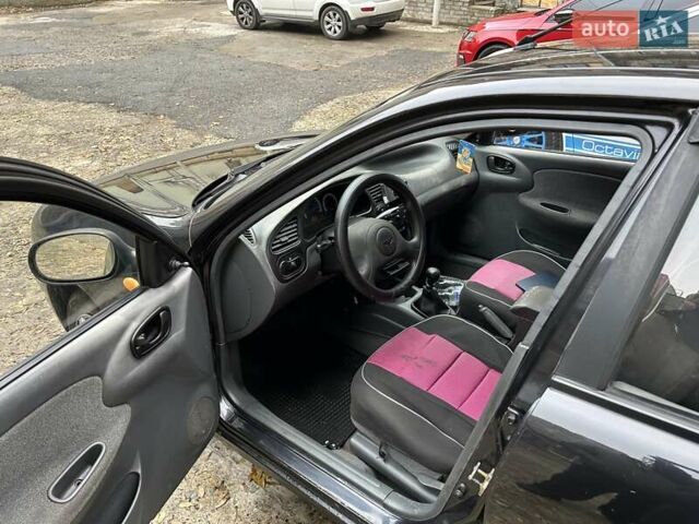 Чорний Деу Ланос, об'ємом двигуна 1.5 л та пробігом 222 тис. км за 1800 $, фото 17 на Automoto.ua