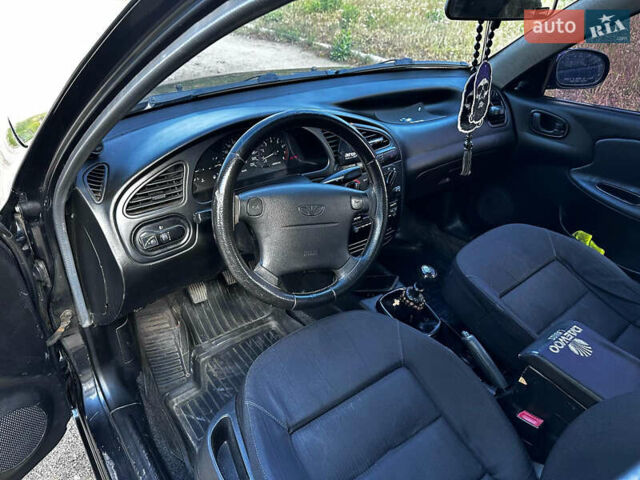 Черный Дэу Ланос, объемом двигателя 1.5 л и пробегом 220 тыс. км за 3100 $, фото 13 на Automoto.ua