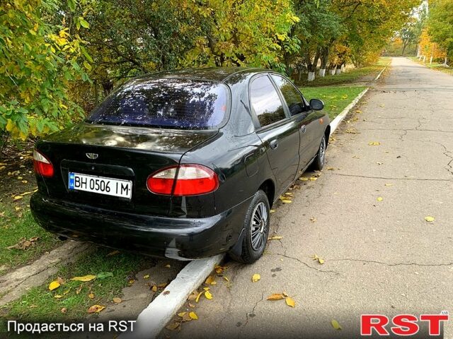 Черный Дэу Ланос, объемом двигателя 1.5 л и пробегом 256 тыс. км за 2600 $, фото 2 на Automoto.ua