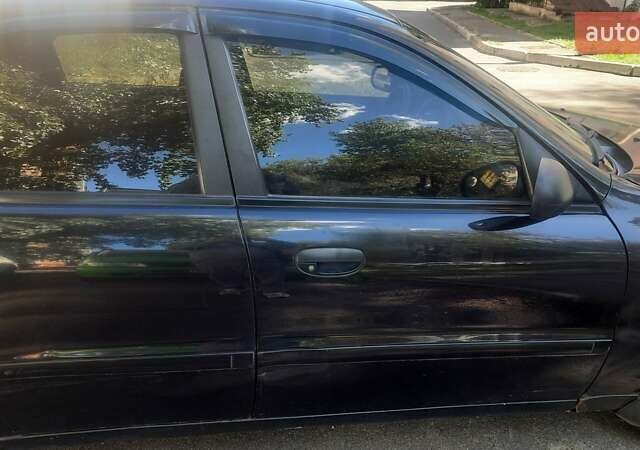 Черный Дэу Ланос, объемом двигателя 1.5 л и пробегом 110 тыс. км за 1500 $, фото 12 на Automoto.ua