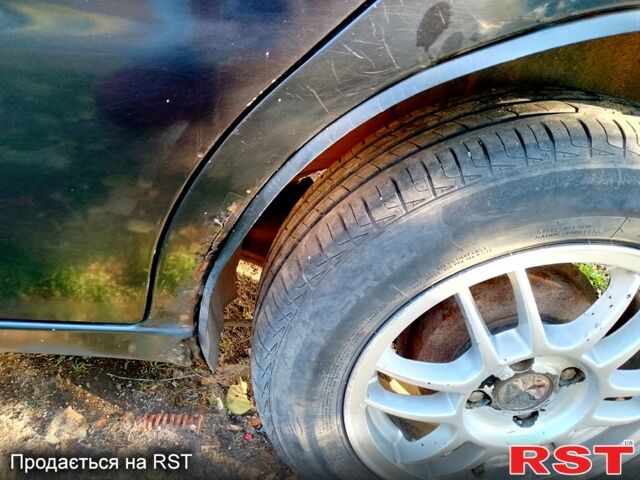 Черный Дэу Ланос, объемом двигателя 1.5 л и пробегом 247 тыс. км за 2100 $, фото 1 на Automoto.ua