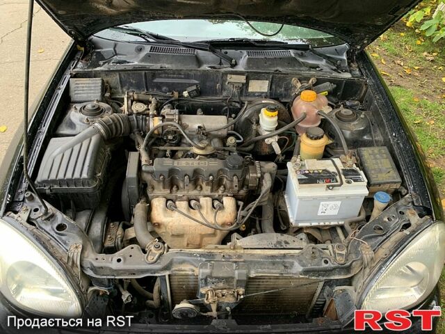 Черный Дэу Ланос, объемом двигателя 1.5 л и пробегом 256 тыс. км за 2600 $, фото 11 на Automoto.ua