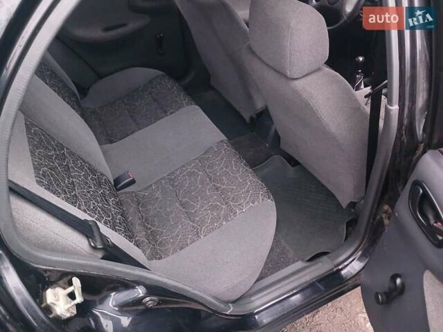 Черный Дэу Ланос, объемом двигателя 1.35 л и пробегом 122 тыс. км за 1699 $, фото 7 на Automoto.ua