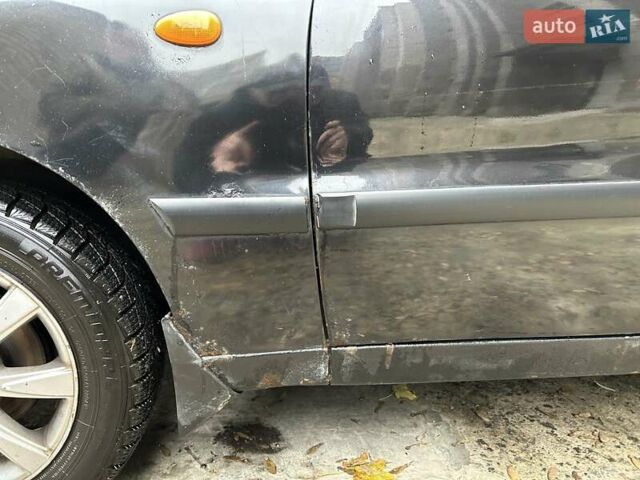 Чорний Деу Ланос, об'ємом двигуна 1.5 л та пробігом 222 тис. км за 1800 $, фото 13 на Automoto.ua