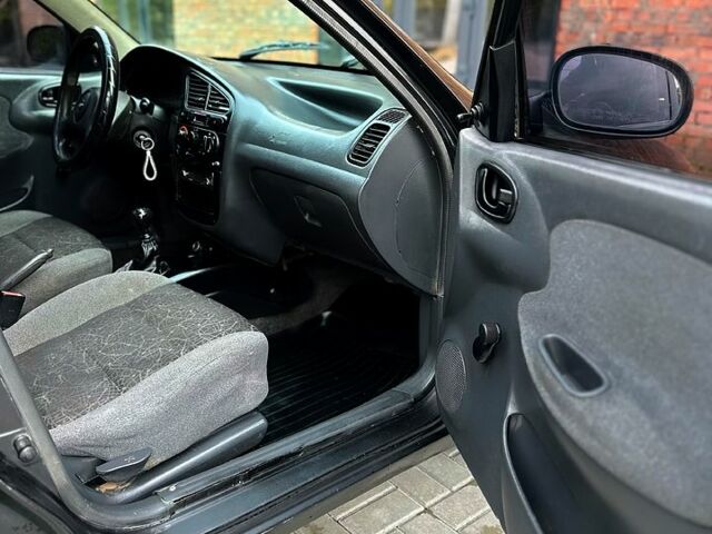 Черный Дэу Ланос, объемом двигателя 1.5 л и пробегом 280 тыс. км за 1450 $, фото 4 на Automoto.ua