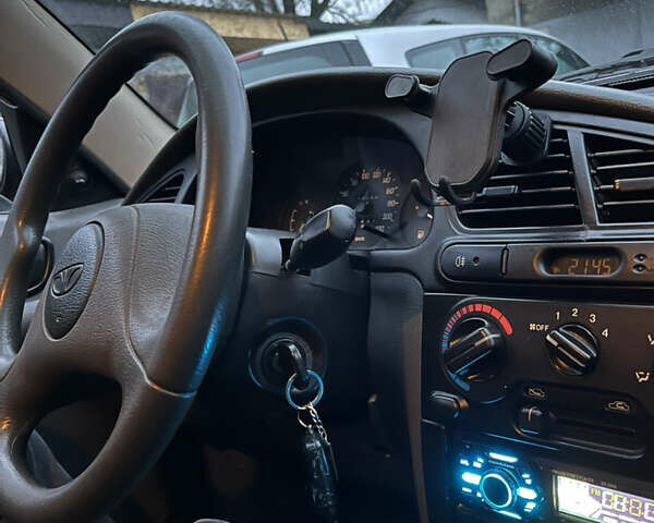 Черный Дэу Ланос, объемом двигателя 1.5 л и пробегом 140 тыс. км за 2500 $, фото 25 на Automoto.ua