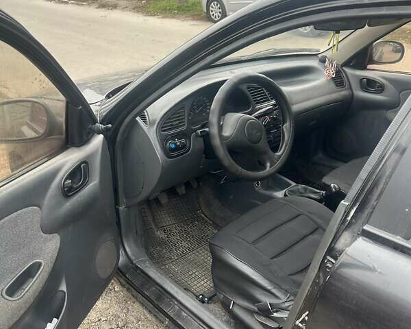 Черный Дэу Ланос, объемом двигателя 1.5 л и пробегом 225 тыс. км за 1200 $, фото 5 на Automoto.ua