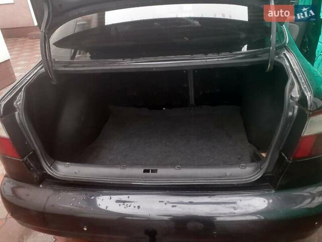 Черный Дэу Ланос, объемом двигателя 1.5 л и пробегом 94 тыс. км за 2800 $, фото 3 на Automoto.ua