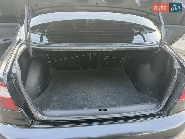 Черный Дэу Ланос, объемом двигателя 1.5 л и пробегом 160 тыс. км за 2800 $, фото 12 на Automoto.ua