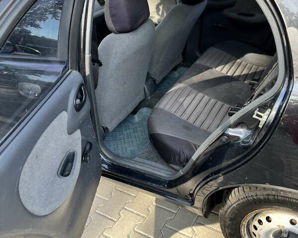 Черный Дэу Ланос, объемом двигателя 1.6 л и пробегом 140 тыс. км за 1800 $, фото 24 на Automoto.ua