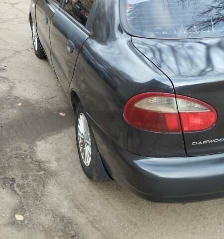 Черный Дэу Ланос, объемом двигателя 1.5 л и пробегом 244 тыс. км за 1650 $, фото 3 на Automoto.ua