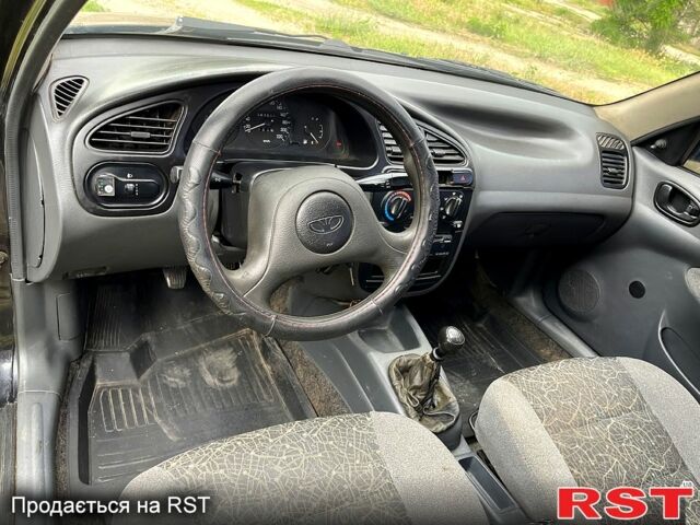 Черный Дэу Ланос, объемом двигателя 1.5 л и пробегом 250 тыс. км за 1400 $, фото 6 на Automoto.ua