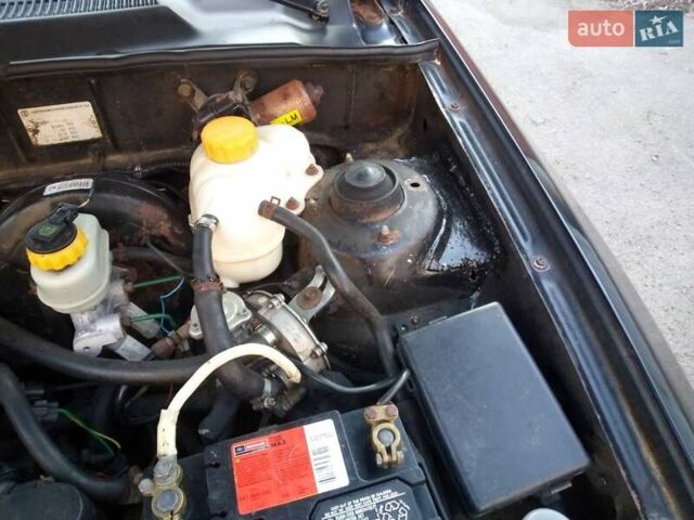 Черный Дэу Ланос, объемом двигателя 1.5 л и пробегом 231 тыс. км за 1999 $, фото 13 на Automoto.ua