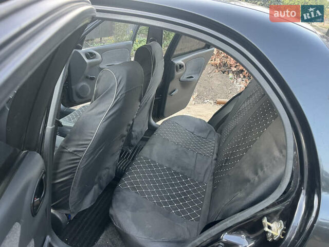 Черный Дэу Ланос, объемом двигателя 1.5 л и пробегом 160 тыс. км за 2800 $, фото 11 на Automoto.ua