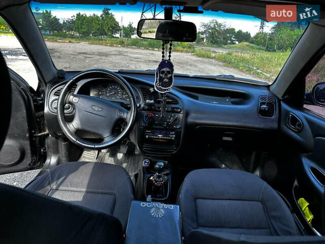 Черный Дэу Ланос, объемом двигателя 1.5 л и пробегом 220 тыс. км за 3100 $, фото 11 на Automoto.ua