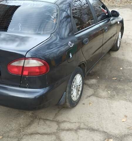 Черный Дэу Ланос, объемом двигателя 1.5 л и пробегом 244 тыс. км за 1650 $, фото 4 на Automoto.ua