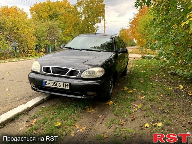 Черный Дэу Ланос, объемом двигателя 1.5 л и пробегом 256 тыс. км за 2600 $, фото 1 на Automoto.ua