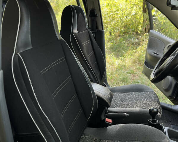 Черный Дэу Ланос, объемом двигателя 1.5 л и пробегом 140 тыс. км за 2905 $, фото 12 на Automoto.ua