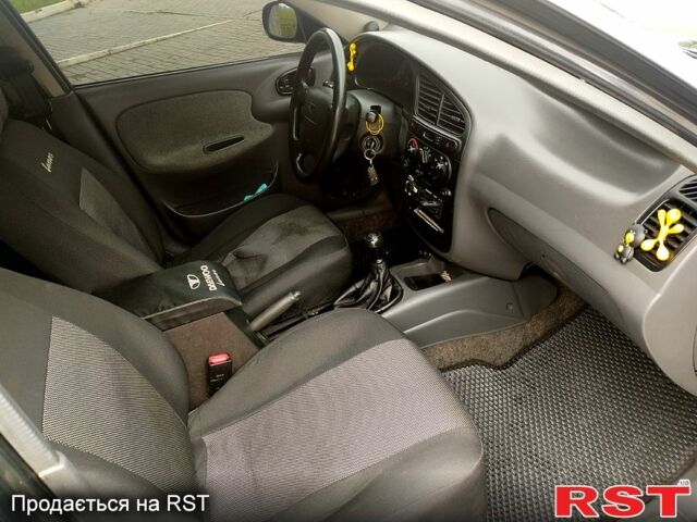 Черный Дэу Ланос, объемом двигателя 1.6 л и пробегом 249 тыс. км за 3500 $, фото 9 на Automoto.ua