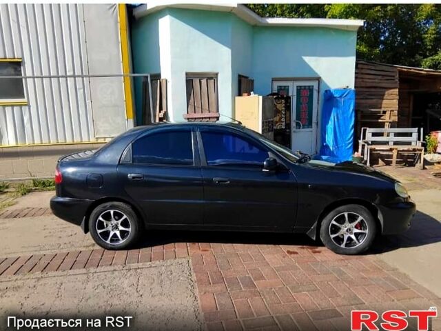 Черный Дэу Ланос, объемом двигателя 1.4 л и пробегом 222 тыс. км за 2100 $, фото 1 на Automoto.ua