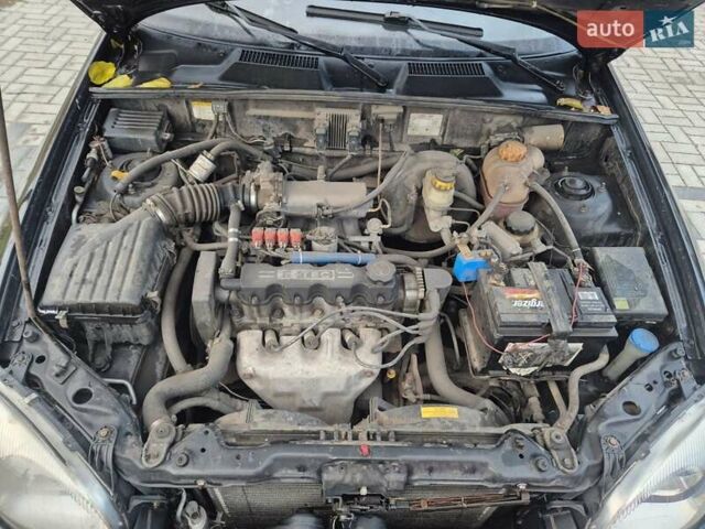 Деу Ланос 2007 у Новомосковске на Automoto.ua Чорний Деу Ланос, об'ємом двигуна 1.5 л та пробігом 252 тис. км за 2500 $, фото 20 на Automoto.ua