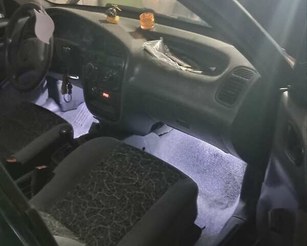 Черный Дэу Ланос, объемом двигателя 1.5 л и пробегом 337 тыс. км за 2600 $, фото 2 на Automoto.ua