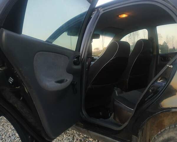 Черный Дэу Ланос, объемом двигателя 1.4 л и пробегом 140 тыс. км за 2200 $, фото 7 на Automoto.ua