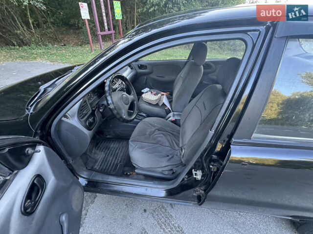 Чорний Деу Ланос, об'ємом двигуна 1.5 л та пробігом 200 тис. км за 1350 $, фото 11 на Automoto.ua
