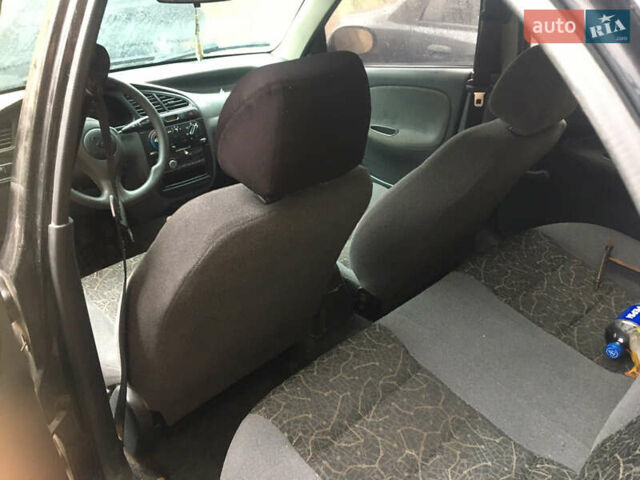 Чорний Деу Ланос, об'ємом двигуна 1.39 л та пробігом 200 тис. км за 900 $, фото 1 на Automoto.ua