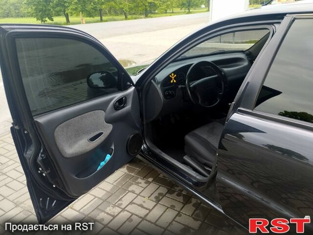 Черный Дэу Ланос, объемом двигателя 1.6 л и пробегом 249 тыс. км за 3500 $, фото 3 на Automoto.ua