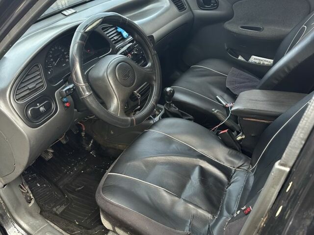 Черный Дэу Ланос, объемом двигателя 1.5 л и пробегом 150 тыс. км за 1700 $, фото 8 на Automoto.ua