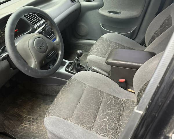 Чорний Деу Ланос, об'ємом двигуна 1.5 л та пробігом 175 тис. км за 2600 $, фото 4 на Automoto.ua