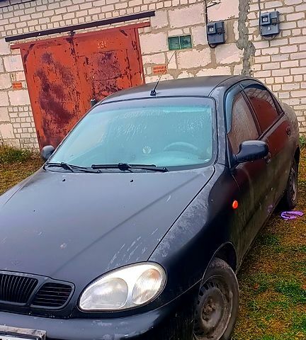 Черный Дэу Ланос, объемом двигателя 1.6 л и пробегом 200 тыс. км за 1700 $, фото 2 на Automoto.ua