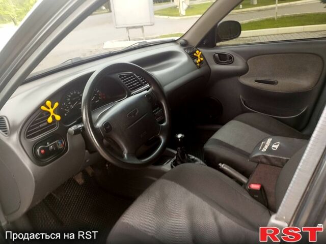 Черный Дэу Ланос, объемом двигателя 1.6 л и пробегом 249 тыс. км за 3500 $, фото 6 на Automoto.ua