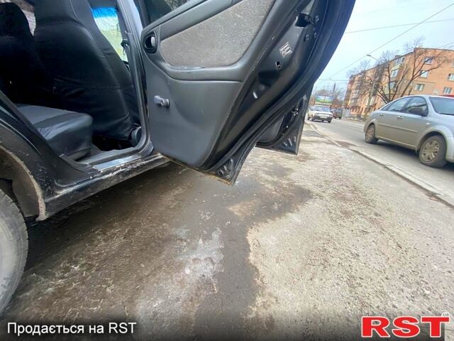 Черный Дэу Ланос, объемом двигателя 1.5 л и пробегом 220 тыс. км за 1350 $, фото 5 на Automoto.ua