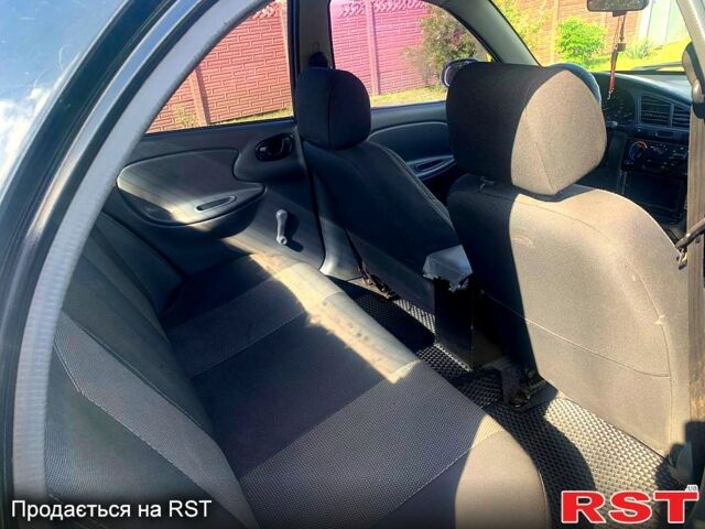 Черный Дэу Ланос, объемом двигателя 1.5 л и пробегом 255 тыс. км за 3200 $, фото 4 на Automoto.ua