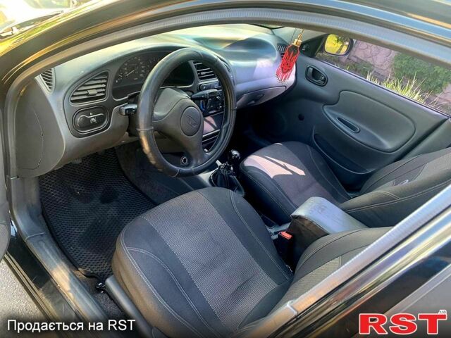 Черный Дэу Ланос, объемом двигателя 1.5 л и пробегом 255 тыс. км за 3200 $, фото 3 на Automoto.ua