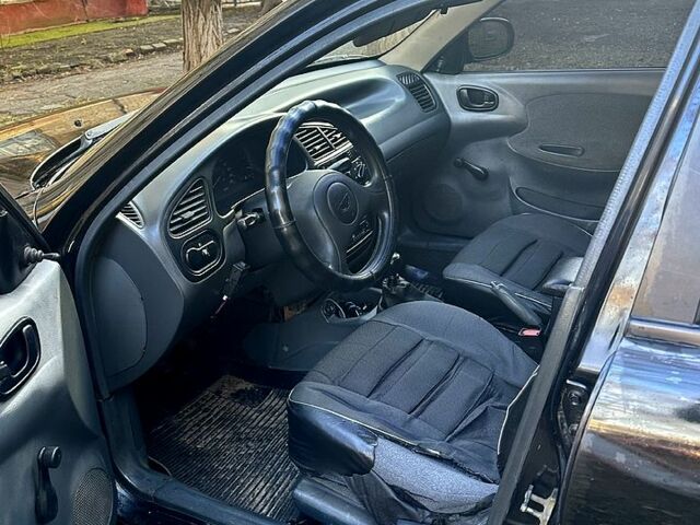 Чорний Деу Ланос, об'ємом двигуна 1.5 л та пробігом 363 тис. км за 1420 $, фото 4 на Automoto.ua