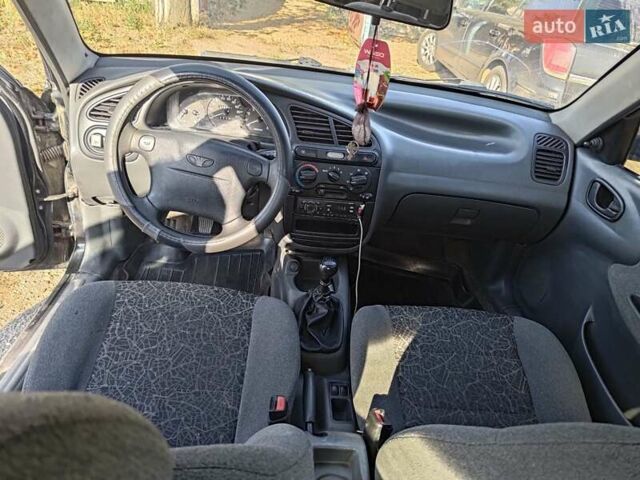 Черный Дэу Ланос, объемом двигателя 1.6 л и пробегом 271 тыс. км за 2000 $, фото 12 на Automoto.ua