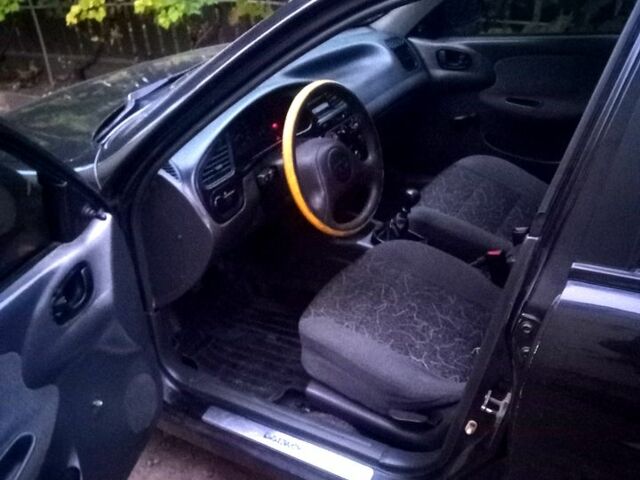 Черный Дэу Ланос, объемом двигателя 1.5 л и пробегом 110 тыс. км за 1780 $, фото 1 на Automoto.ua