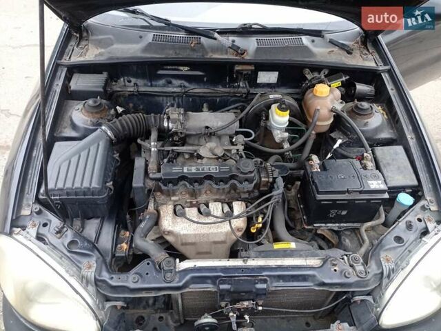 Черный Дэу Ланос, объемом двигателя 1.5 л и пробегом 141 тыс. км за 1700 $, фото 11 на Automoto.ua