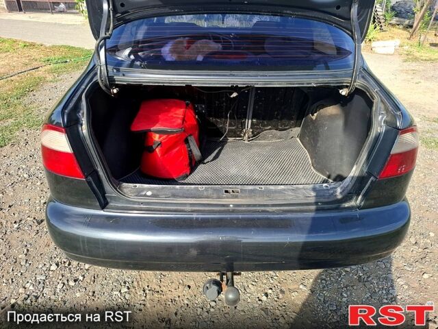 Черный Дэу Ланос, объемом двигателя 1.5 л и пробегом 217 тыс. км за 2800 $, фото 5 на Automoto.ua