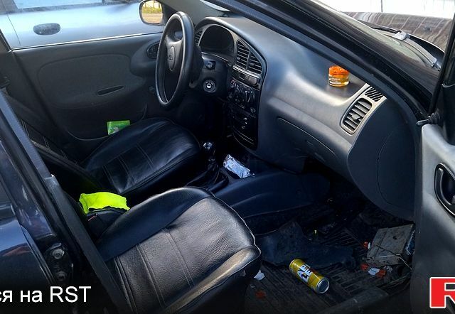 Чорний Деу Ланос, об'ємом двигуна 1.5 л та пробігом 269 тис. км за 1300 $, фото 4 на Automoto.ua