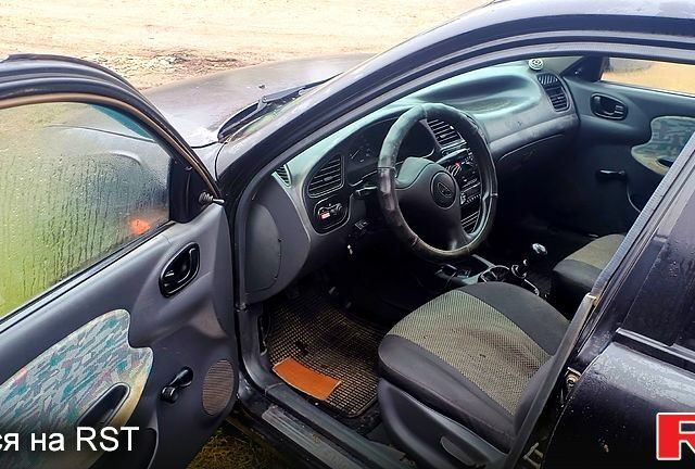 Черный Дэу Ланос, объемом двигателя 1.6 л и пробегом 200 тыс. км за 1700 $, фото 3 на Automoto.ua