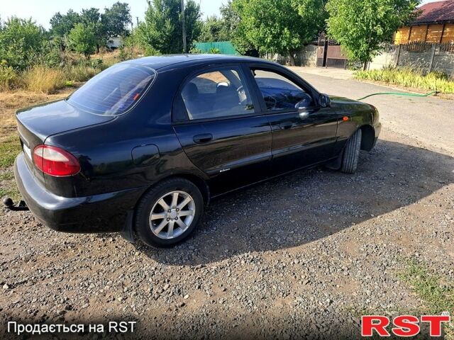 Черный Дэу Ланос, объемом двигателя 1.5 л и пробегом 217 тыс. км за 2800 $, фото 2 на Automoto.ua