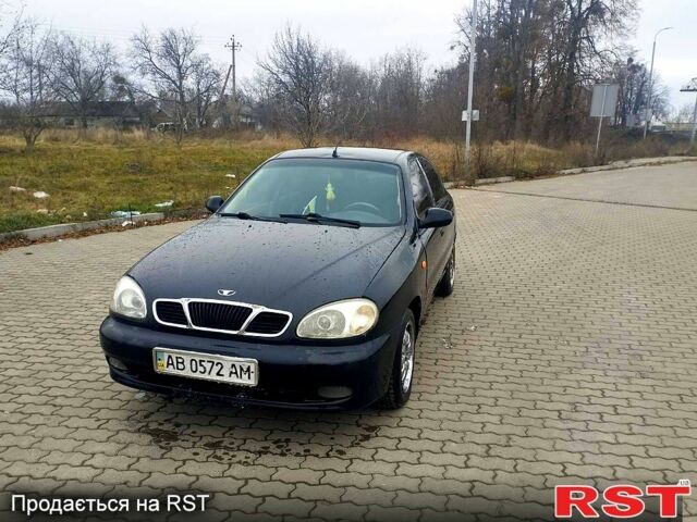 Черный Дэу Ланос, объемом двигателя 1.6 л и пробегом 200 тыс. км за 1600 $, фото 1 на Automoto.ua