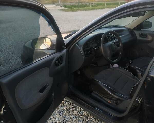 Черный Дэу Ланос, объемом двигателя 1.4 л и пробегом 140 тыс. км за 2200 $, фото 5 на Automoto.ua