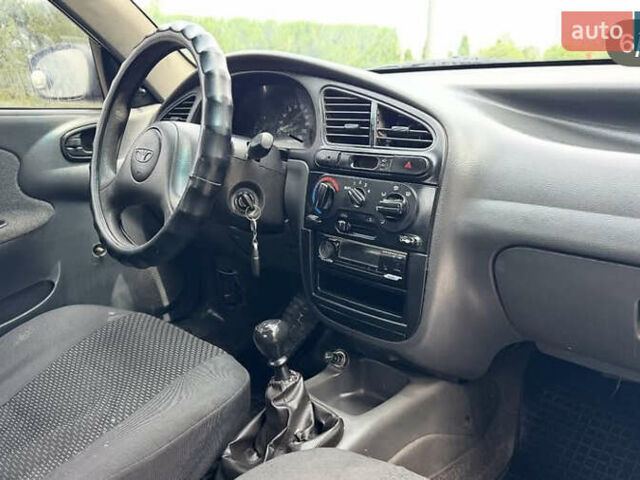 Черный Дэу Ланос, объемом двигателя 1.5 л и пробегом 233 тыс. км за 2200 $, фото 5 на Automoto.ua