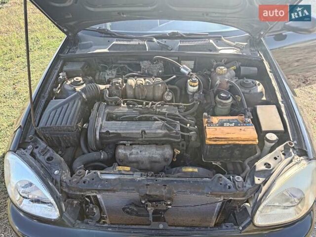 Черный Дэу Ланос, объемом двигателя 1.6 л и пробегом 271 тыс. км за 2000 $, фото 13 на Automoto.ua